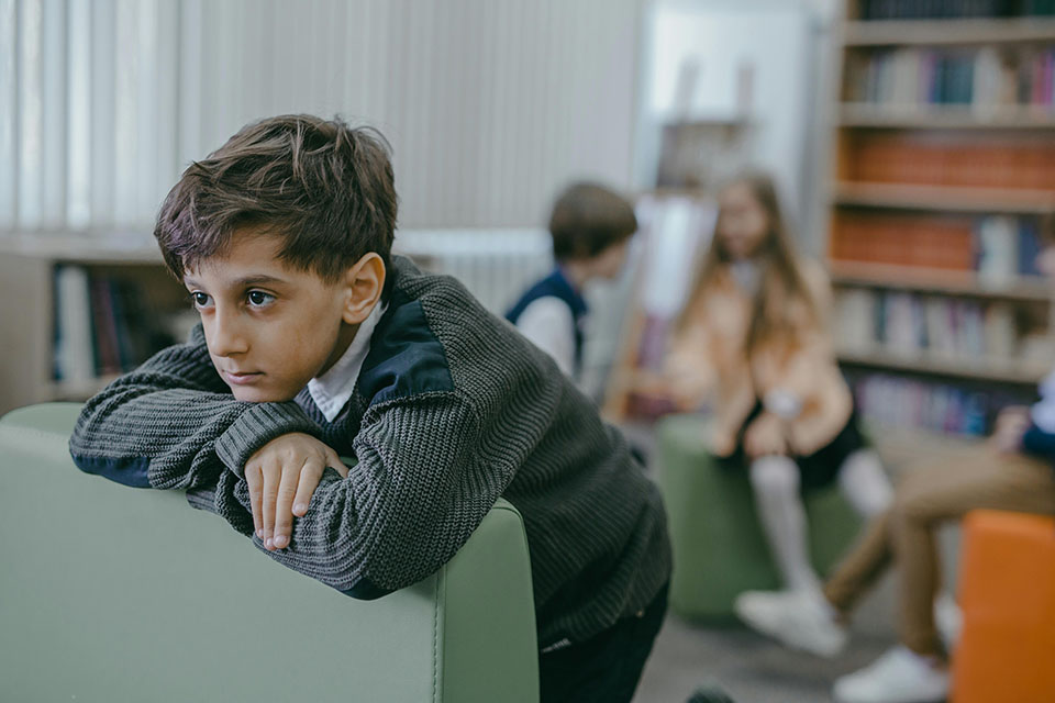 boy feeling outcast at school because of his underbite