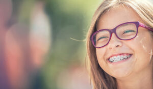 Portrait of a happy smiling teenage girl with braces