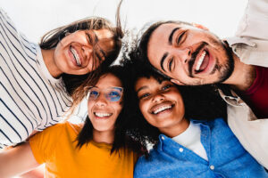group of adults wearing invisalign and braces